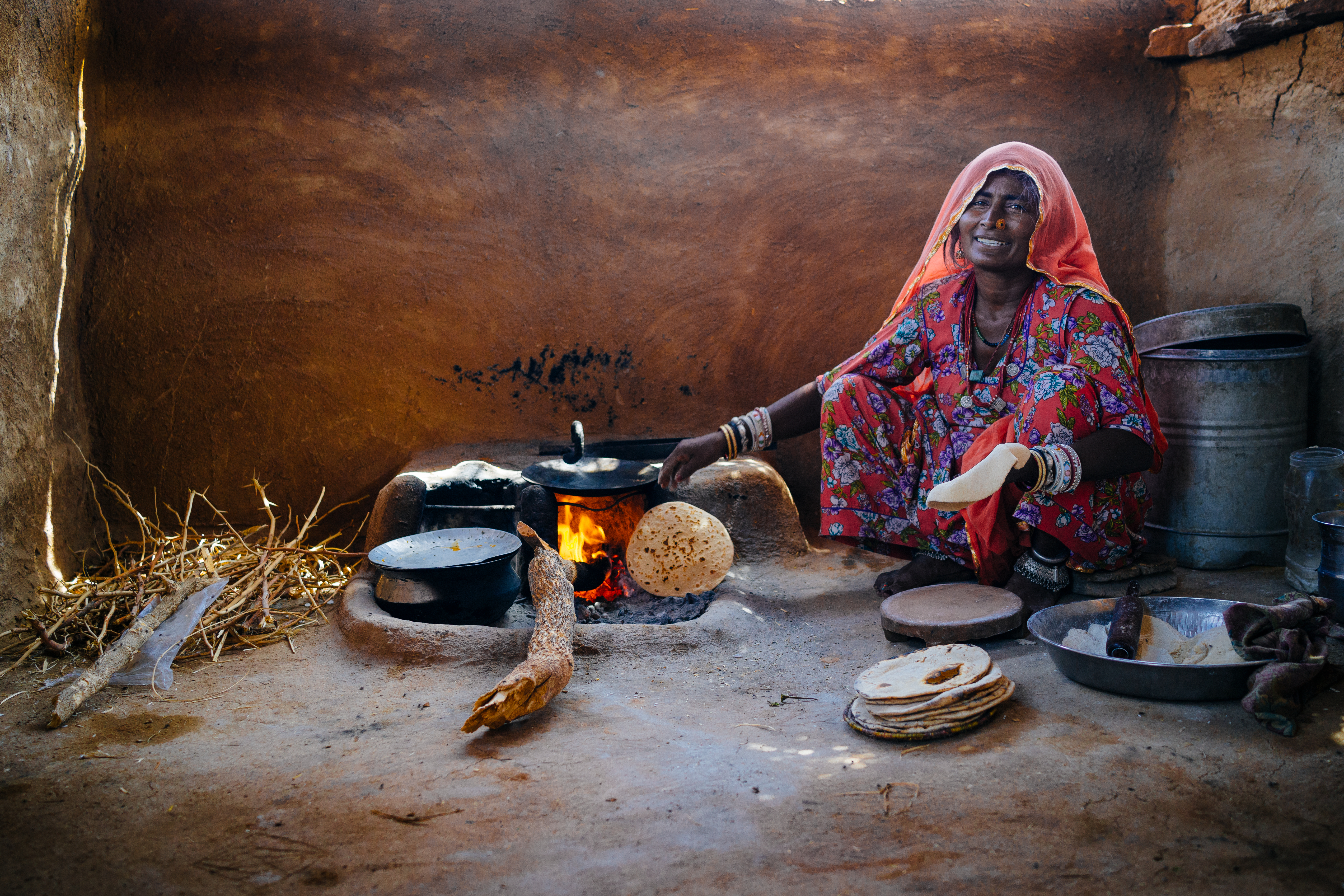 Women preparing food in mud hut on March 20 , 2014 in Jaisalmer,India