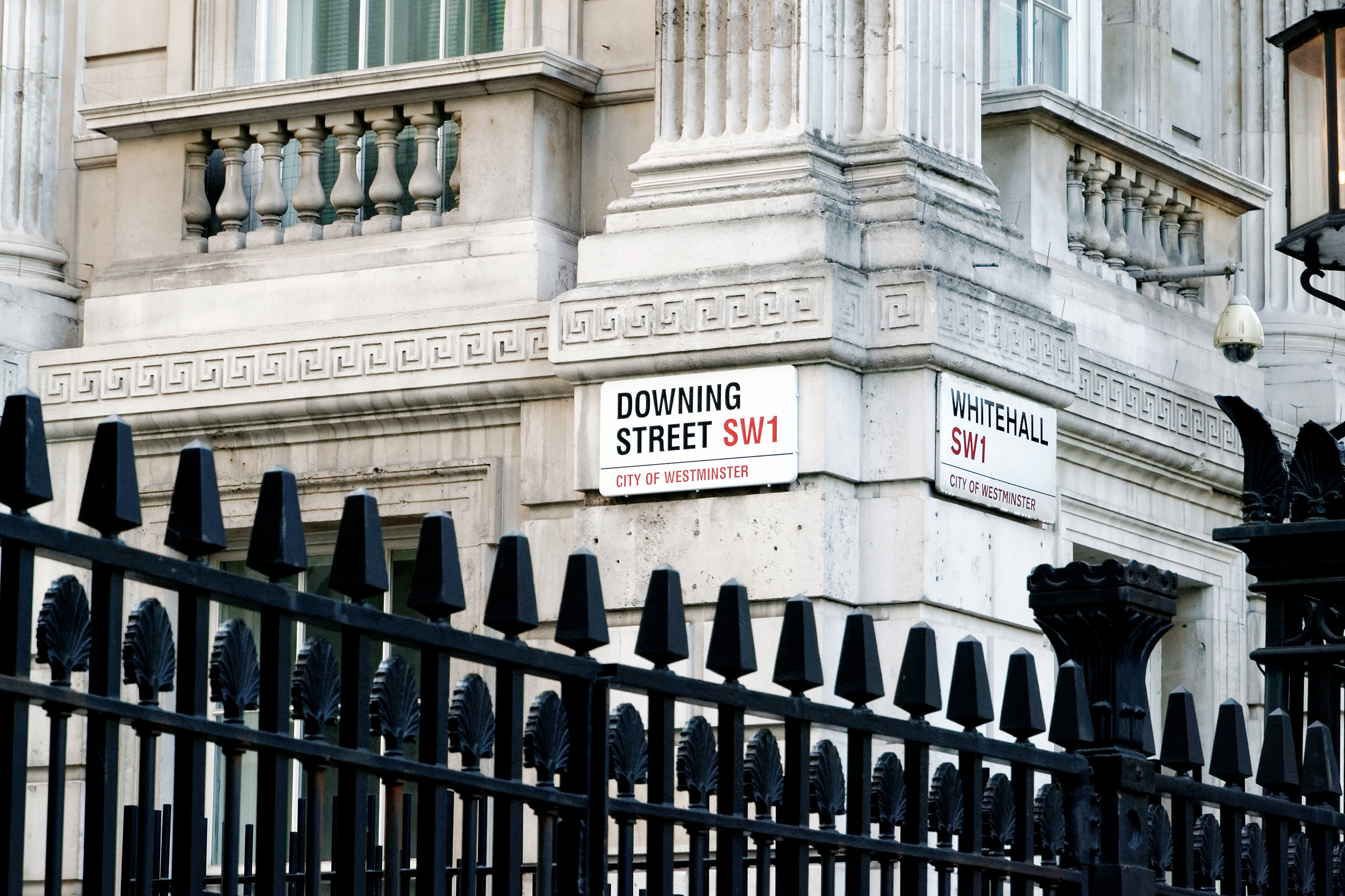 Road signs for Downing Street and Whitehall at the gates of Downing Street